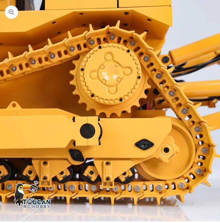 Close up of metal track links on an RC machine